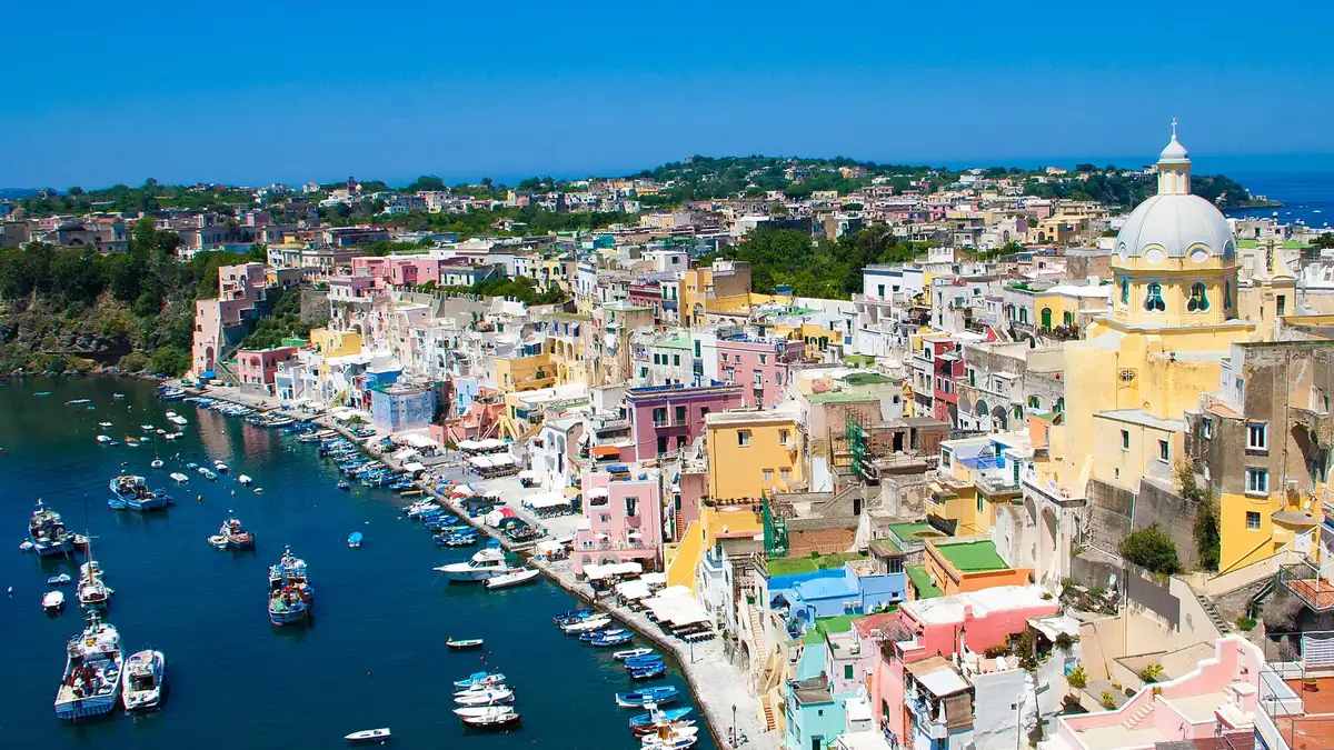 Procida, the closest island to Naples airport Marina Corricella on Procida, the closest island to Naples airport, reached by hydrofoil from Molo Beverello in about 40 minutes